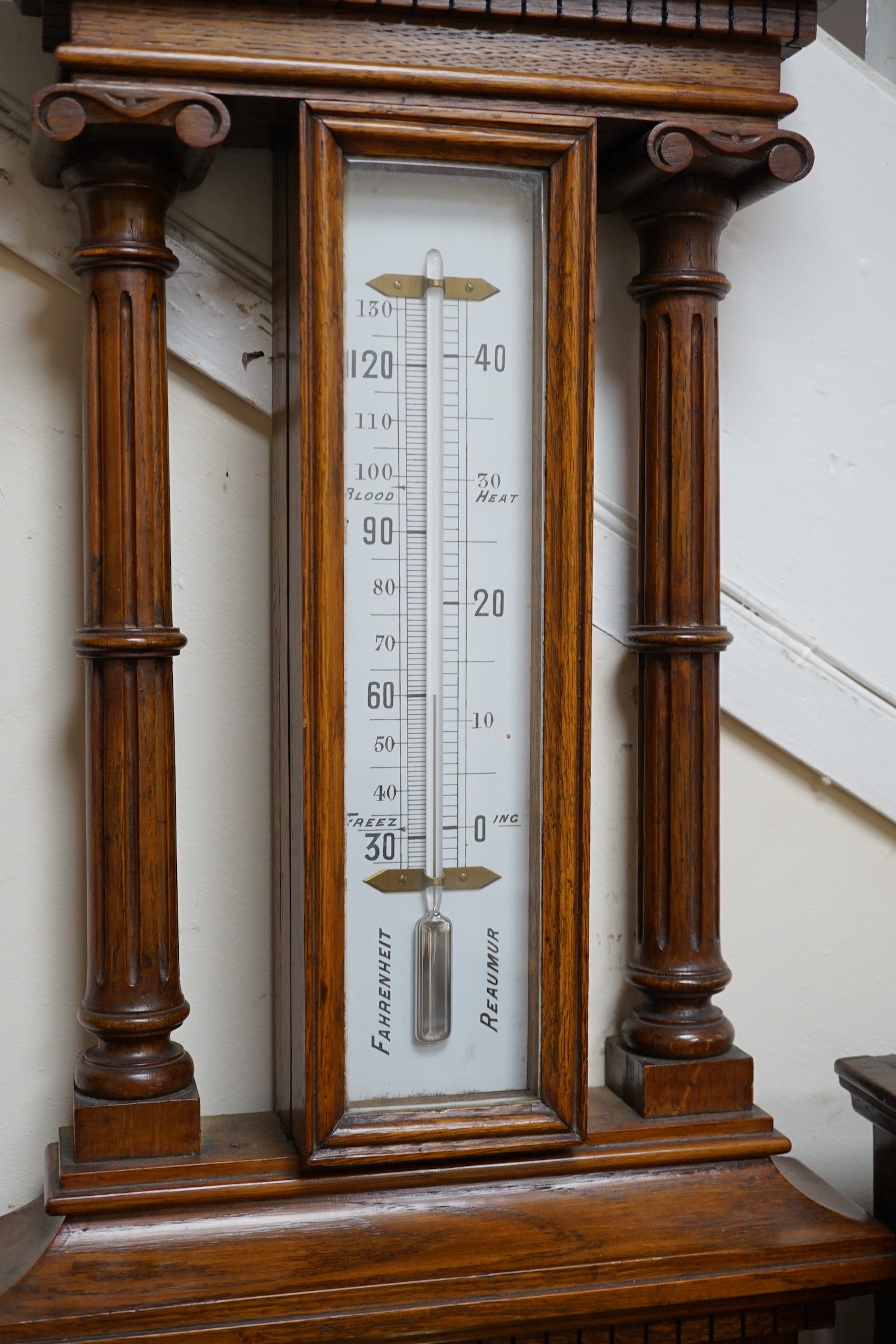 A Victorian Spiridon & Son oak cased barometer / thermometer. Approx 100cm tall